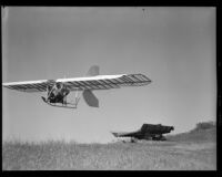 Man flying in a glider with a wagon on the ground below (possibly during the filming of Gallant Journey), 1946