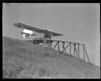Man navigating a glider down a ramp (possibly during the filming of Gallant Journey), 1946