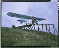 Man navigating a glider down a ramp (possibly during the filming of Gallant Journey), 1946