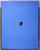Man flying under a balloon (possibly during the filming of Gallant Journey), 1946