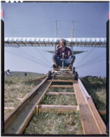 Man sitting in a glider on a ramp (possibly during the filming of Gallant Journey), 1946