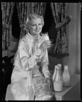 Allyn Drake, actress, posing for a milk advertisement, circa 1934-1935