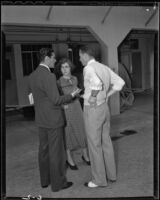 Francis Lederer, actor, speaking to Mary C. McCall, Jr., screenwriter, and Elliott Nugent, director, during the filming of It's All Yours, 1937