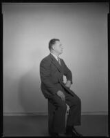 Man (possibly Joe Cook) sitting in profile, circa 1926-1939