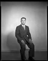 Man (possibly Joe Cook) wearing a suit, circa 1926-1939