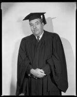 Walter Connolly, actor, wearing a graduation hat and gown, circa 1932-1939