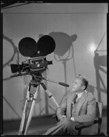 David Burton, director, with a film camera, circa 1933-1934