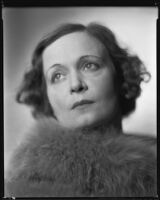 Woman wearing fur stole, circa 1926-1939
