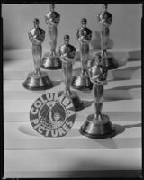 Mini Academy Awards Oscar statuettes with a Columbia Pictures seal, 1935