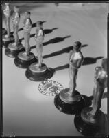 Academy Awards statuettes with a Columbia Pictures seal in between, circa 1935-1938