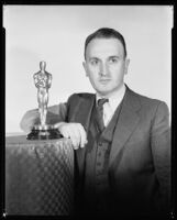 John Livadary, Sound Director at Columbia Pictures, with his Academy Award for Sound Recording for One Night of Love, 1935