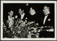 Lionel Barrymore and Clark Gable, actors, with Irvin Cobb, author, and Nathan Levinson, sound engineer, at the seventh Academy Awards, Los Angeles, 1935