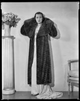 Geneva Mitchell, actress, modeling a fur coat, circa 1931-1936