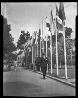 George Murphy, actor, walking down a path at the California Pacific International Exposition, San Diego, 1935