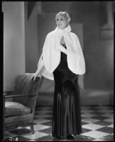 Peggy Hamilton modeling a gown and ermine cape, 1930