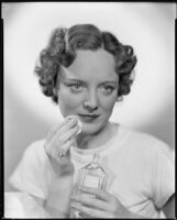 Sheila Mannors, actress, applying skin freshener to her face, 1934