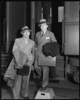Laurence Stallings, screenwriter, and Lewis Milestone, director, stepping off of a train, circa 1933