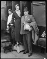 Gilbert Miller, director, and his wife, Kitty, at a train station, circa 1934