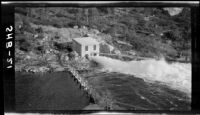 Gatehouse and discharge through needle valve from the Bowman Reservoir near the head of the Bowman-Spaulding Conduit, Nevada County (Calif.), 1928