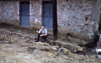 Mexico (Chalma?) - Street and dwelling with man seated on curb, between 1960-1964