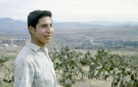 Mexico (Jalisco) - Young man on hill with small town in, between 1960-1964