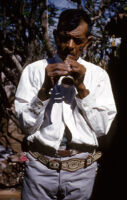 Mexico - Man playing chirimía, between 1960-1964