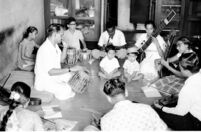Madhukar Barve teaching students to play musical instruments, Mumbai (India), 1963