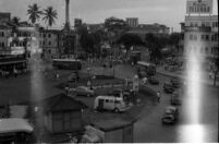 N63 Black and White Negatives: Frame 121   [VW van of Nazir Jairazbhoy parked in a city square, (Mumbai ?, Valodara?)]