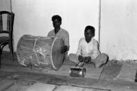Kathori musicians, one with a dhol and one with a drum made from a metal can, Khandala, Lonāvla (India), 1963