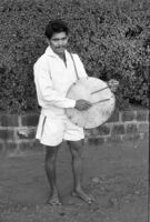 Halgi player  in the forecourt of the Mahalakshmi Temple, Kolhapur (India), 1963