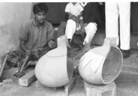 Instrument maker with sitar or tanpura from gourds at  Vilayat Khan brothers, Miraj (India), 1963