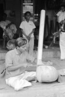 Instrument maker sanding a tanpura at Vilayat Khan brothers, Miraj (India), 1963