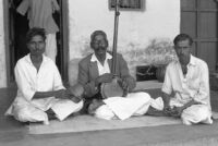 Musicians M. M Naik, G. Pawar, and M. L. Shaluka,  holding a dimdi, an ektar and a jhanjh, Miraj (India), 1963