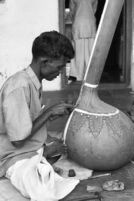 Instrument makers applying paint at the shop of Abdul Karim Ismail, instrument maker, Miraj (India), 1963
