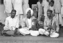 Musicians, Babu Shirbande, D. G. Kadam, S. K. Ghadge, with instruments: dholki, daf and tuntune, Miraj (India), 1963