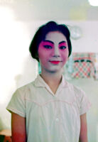 Completion of make-up for Manchurian princess for the first of Szu Lang T'an Mo (see slides L-1 to L-12)
