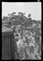 Ralph Cornell and Guy Fleming at the edge of a cliff in Torrey Pines State Reserve, San Diego County, circa 1931