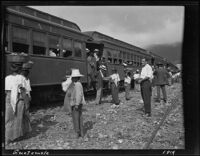 People outside of a passenger train, Guatemala, 1914